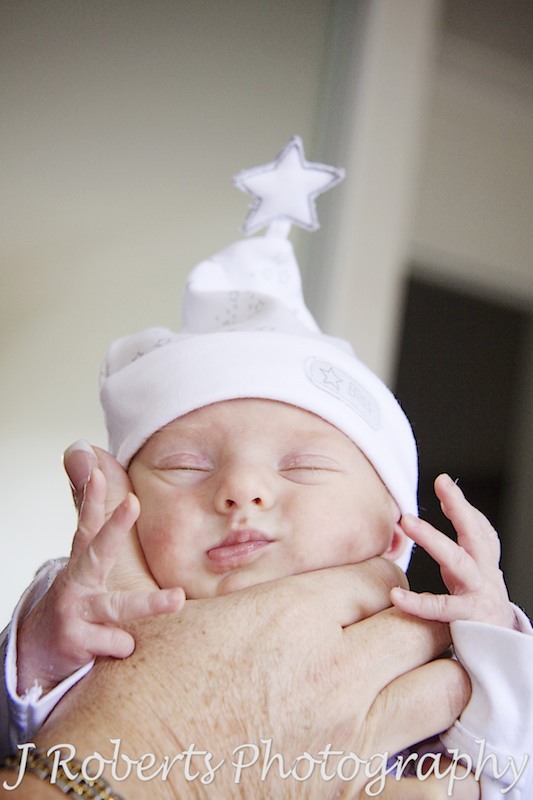 Baby sleeping with little star hat on - baby portrait photography sydney